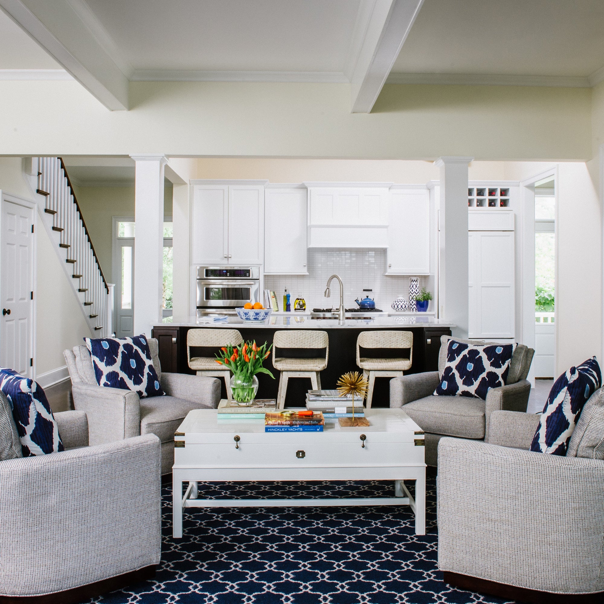 Blue & white conversation area just off a white kitchen. Jamie Merida Interiors.