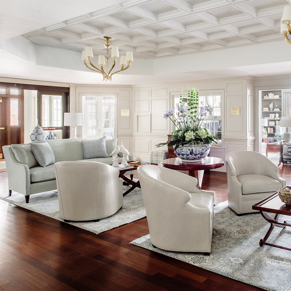 The lobby of the Bellmoor Inn - shows deep laminate floors with area rugs. Commercial project by Bountiful Flooring.