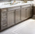 Bathroom floor with rug tile pattern in neutral tones. Designed and installed by Bountiful Flooring.